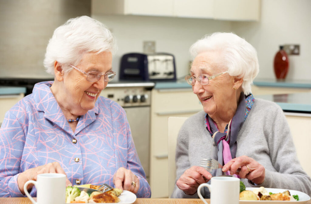 Duo of senior women enjoying a healthy meal together