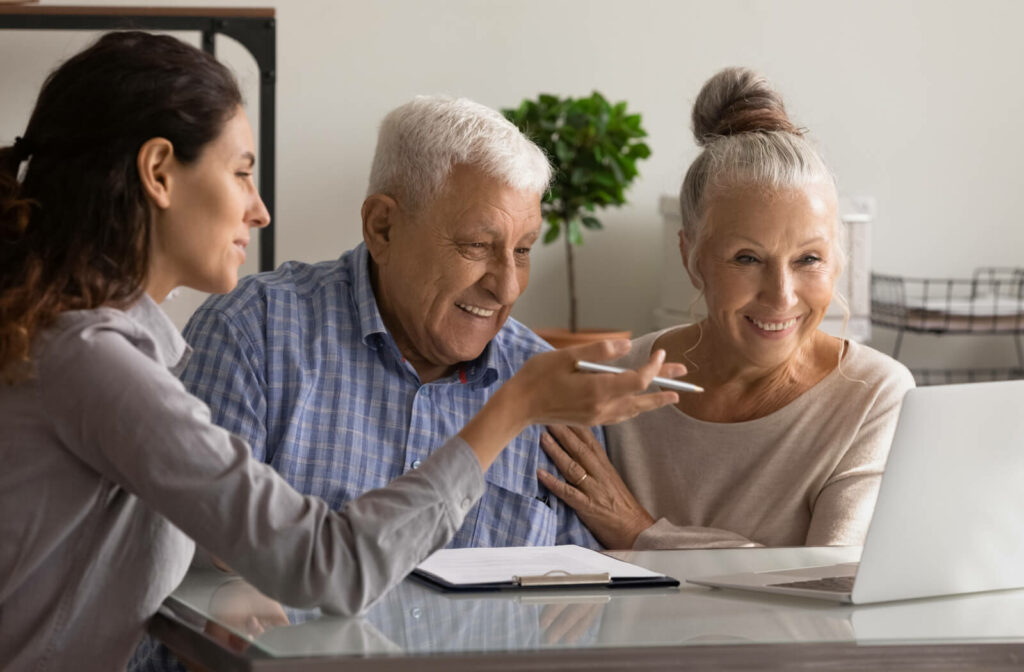 a senior man and woman discuss senior living options with a consultant