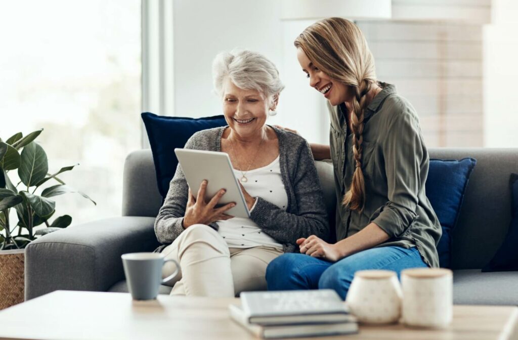 A mature parent and their adult child explore assisted living communities online.